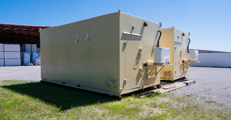 Modular ammunition storage magazines positioned at a secure storage facility.